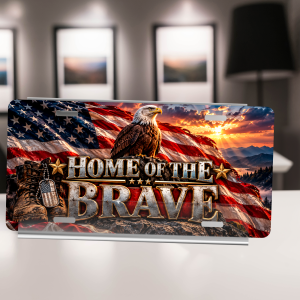 Home of the Brave license plate with eagle, American flag, combat boots, and mountain sunset